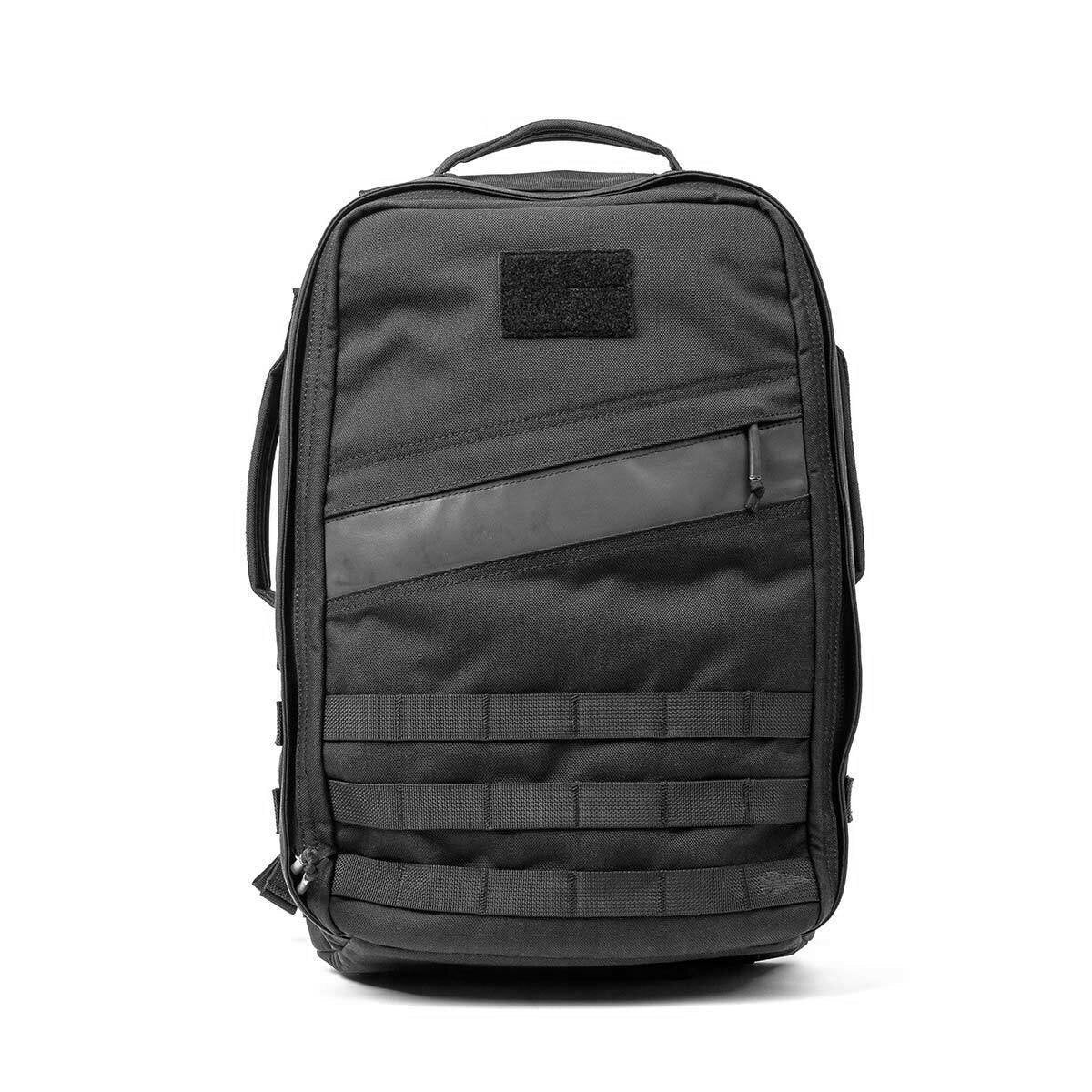 Black tactical backpack with a top handle, front zipper pocket, and MOLLE webbing on the bottom front.