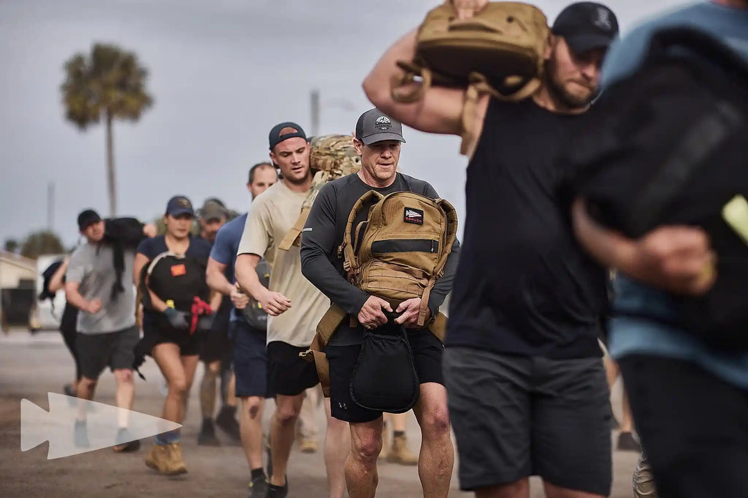Group rucking outdoors with GORUCK backpacks, showcasing durable rucking gear in action