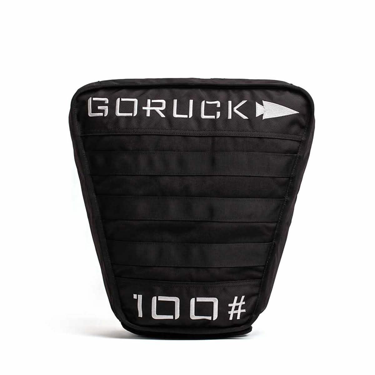 The Sand Tombstones by GORUCK is a black sandbag adorned with white text and an arrow logo, featuring 