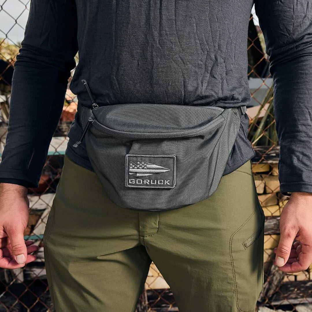 GORUCK tactical waist pack worn outdoors, rugged gear for rucking and adventure