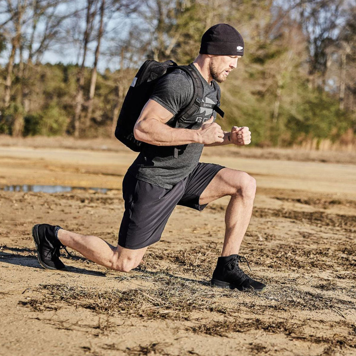 A man running in the dirt.