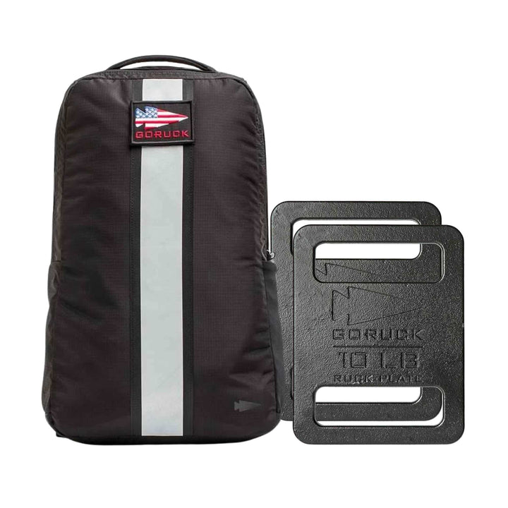 The Basic Rucker Bundle features a black GORUCK backpack with a USA flag patch and two black 10 lb ruck plates, ideal for rucking or weighted workouts.