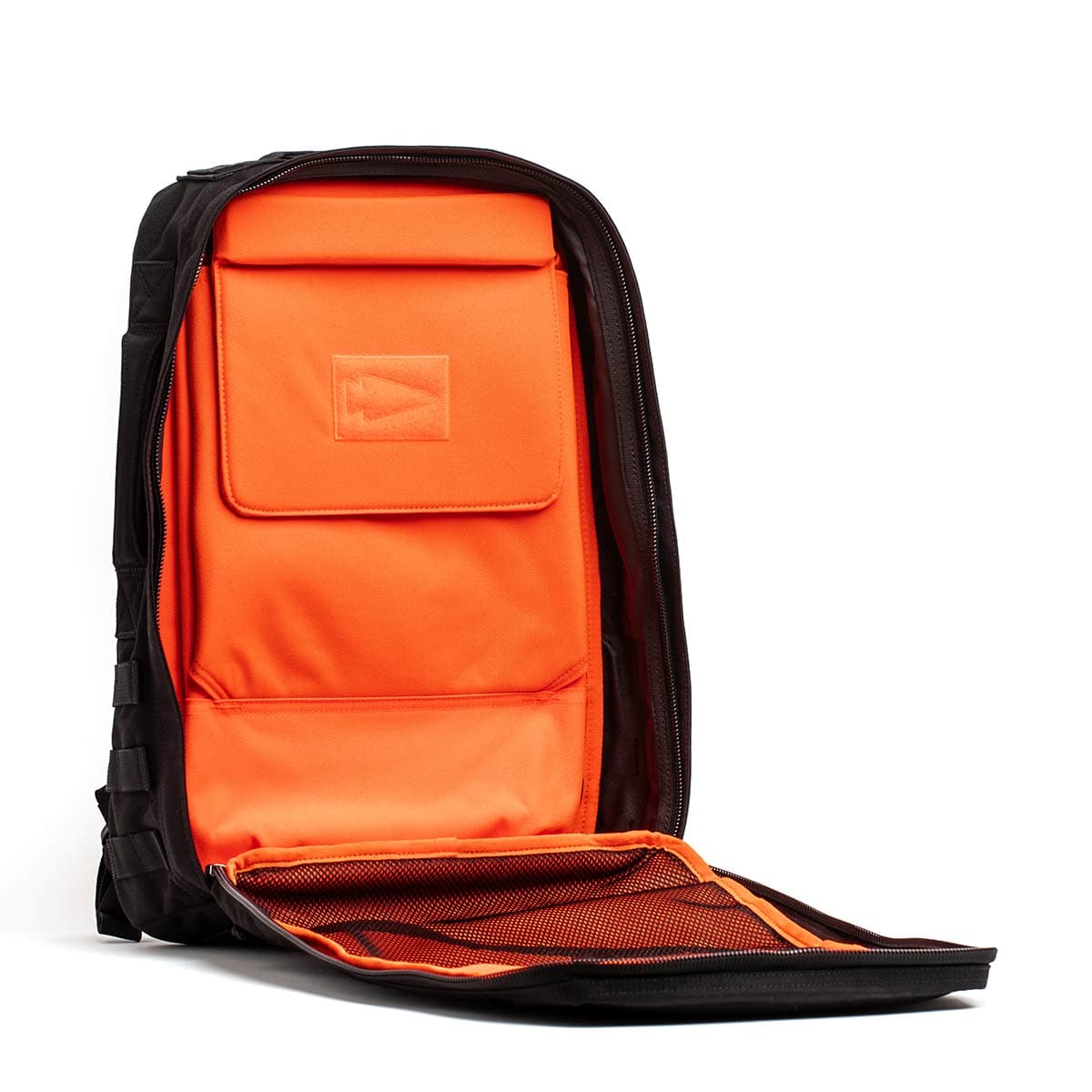 GORUCK rucksack interior with bright orange lining and zippered mesh pocket