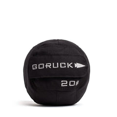 The GORUCK Sand Medicine Ball, featuring a sleek black design with a white logo and "20" text, is ideal for enhancing core stability in your home gym.