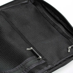 Close-up of an open black mesh organizer, featuring zippers and storage sections, engineered with the precision of GORUCK's GR2 backpacks.