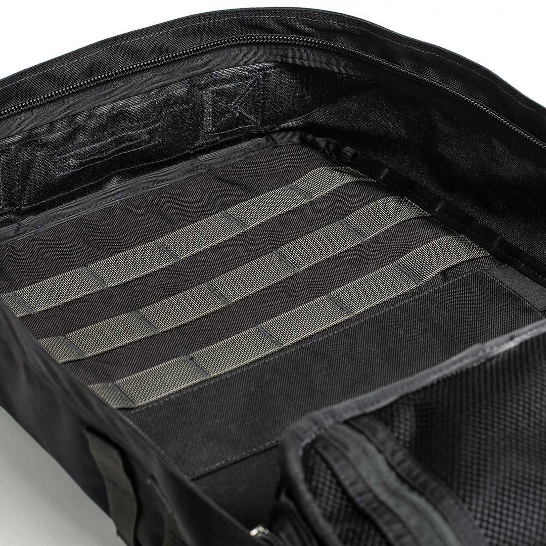 The GORUCK GR2 - USA in black highlights its 210D CORDURA® interior, complete with compartments and horizontal straps for organized packing. Its design is carry-on compliant, making it ideal for travel.