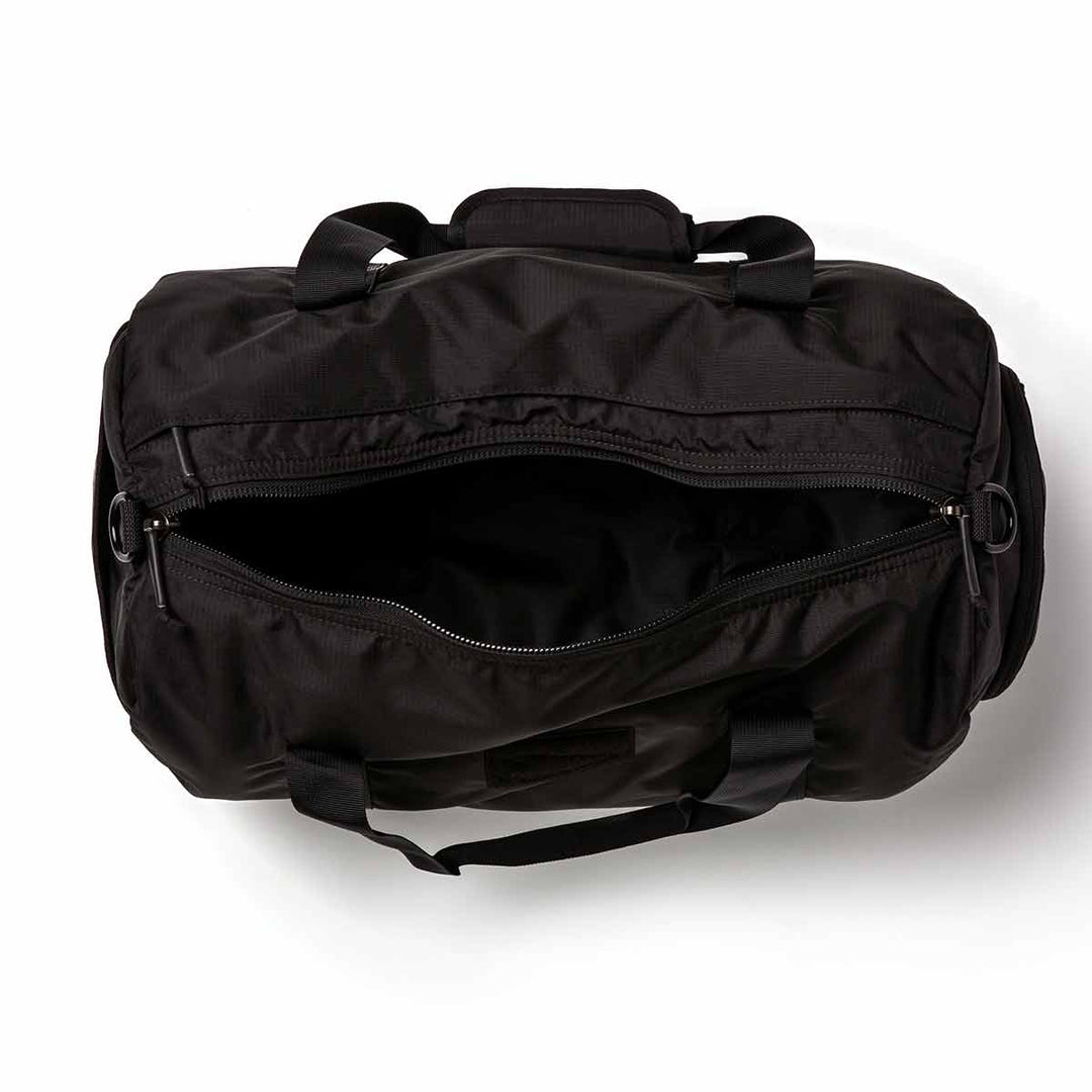 The GORUCK Gym Bag - Ripstop ROBIC® features a sturdy design with an open zipper, showcasing its empty interior against a plain white background.