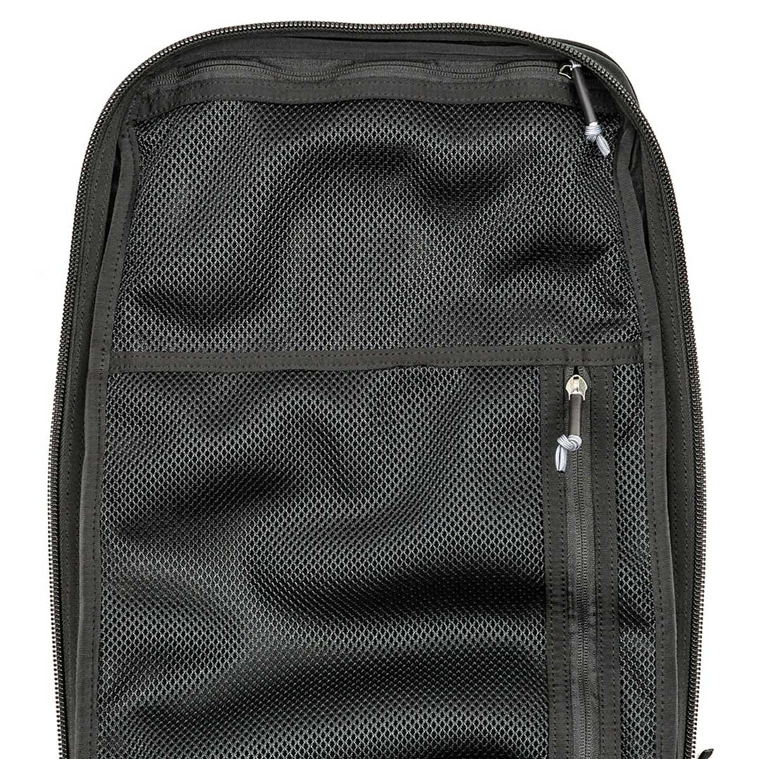 The GR2 - USA by GORUCK is a black mesh travel organizer featuring multiple zippers, designed to fit snugly into any rucksack. It is carry-on compliant and comes with the Scars Lifetime Guarantee, ensuring durability for all your adventures.