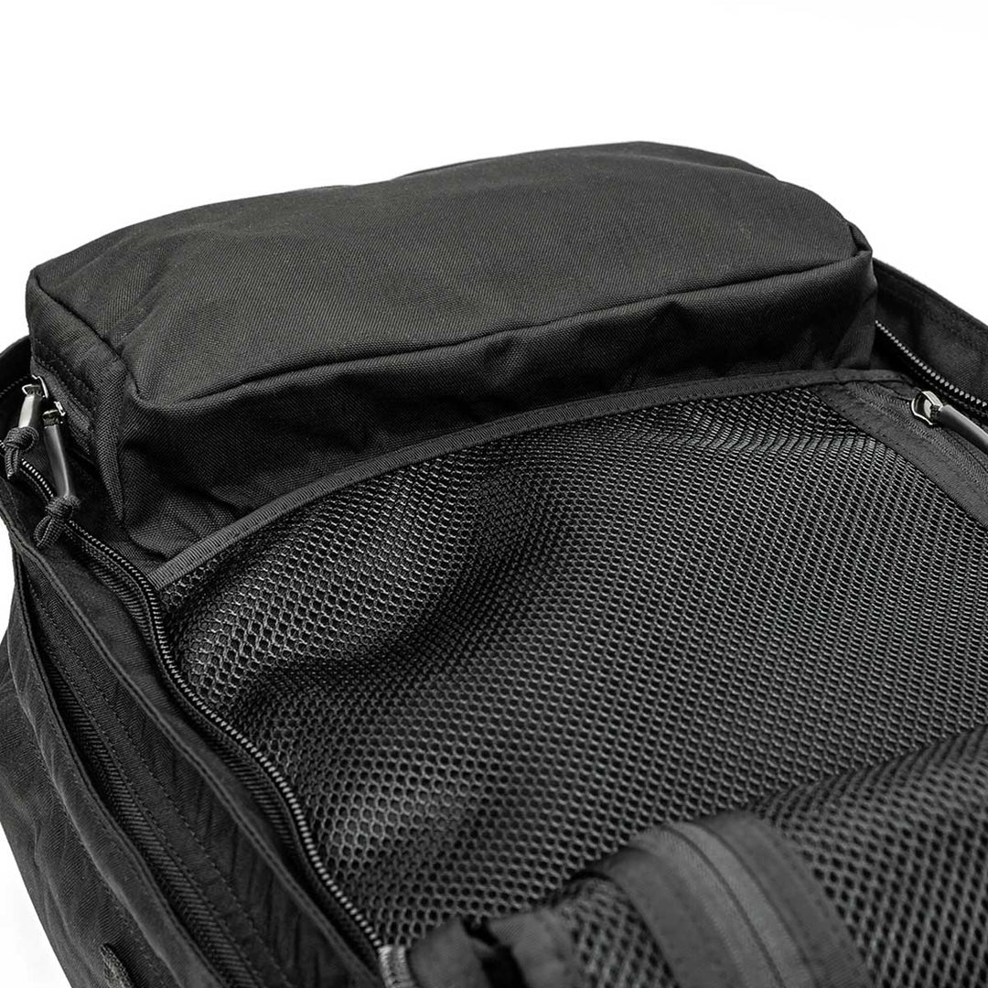 Explore the GORUCK GR2, a versatile open black rucksack featuring mesh compartments and a top storage pocket, designed to be carry-on compliant for easy travel.