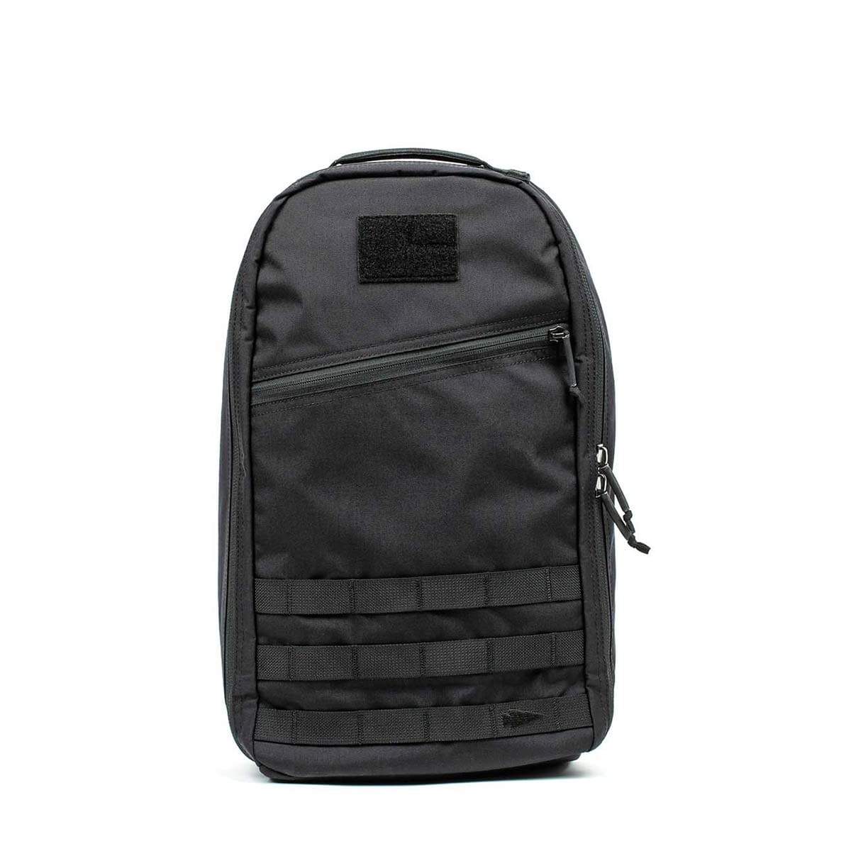 The Bullet Ruck - Classic -15L is a sleek black tactical backpack featuring a front zipper pocket and horizontal webbing, ideal as a 15L daypack for carrying daily essentials.