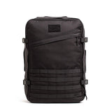The GORUCK GR3 – Cordura backpack in black features multiple straps, buckles, and a zippered front pocket—ideal as a carry-on rucksack for adventure travel, shown on a white background.