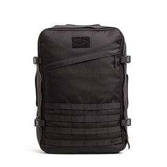 The GORUCK GR3 – Cordura backpack in black features multiple straps, buckles, and a zippered front pocket—ideal as a carry-on rucksack for adventure travel, shown on a white background.