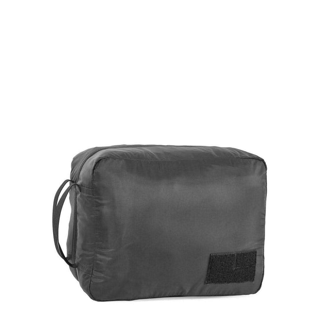 The GORUCK Packing Cubes are black, ultra-light nylon pouches with a side handle and a rectangular front patch—ideal for travel organization. Shown on a white background.