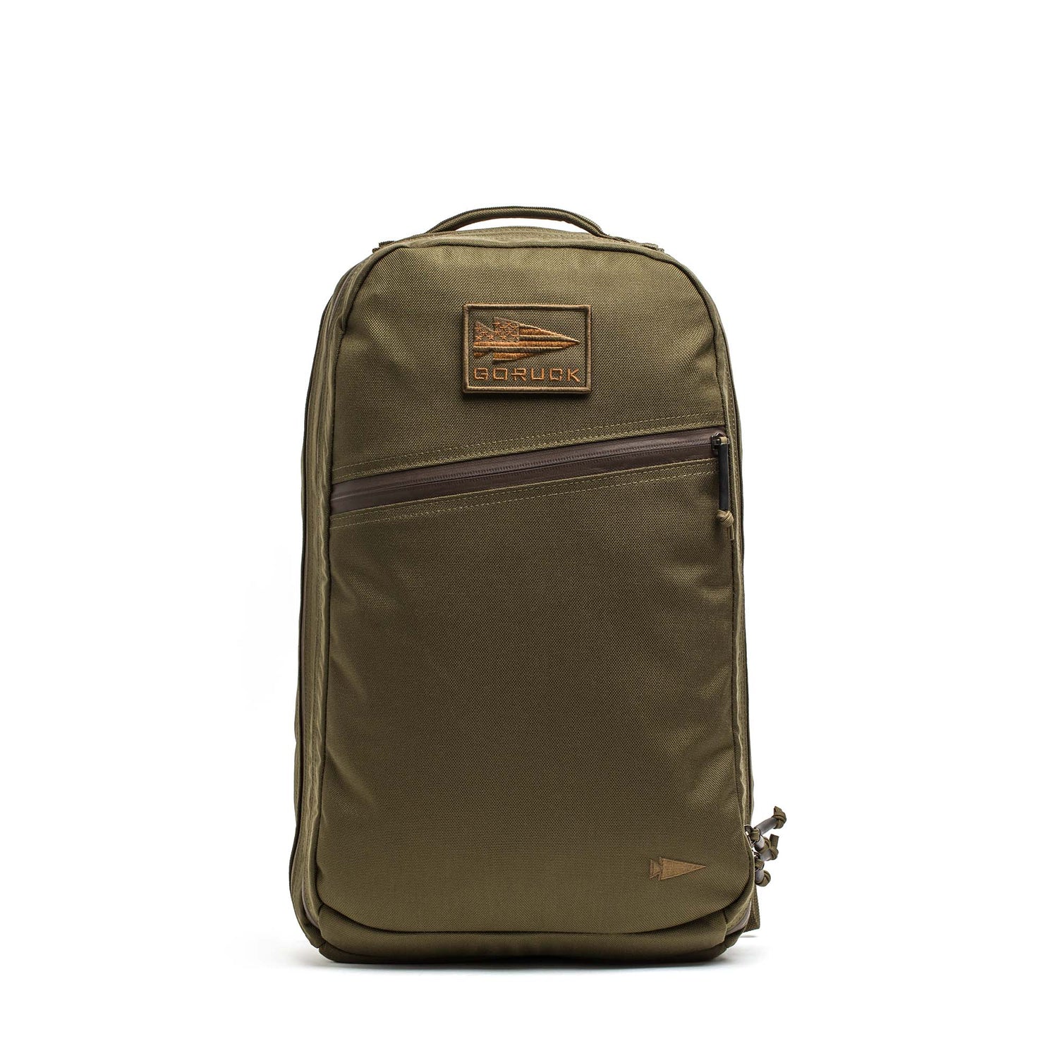 The Double Compartment Bullet Ruck - Ballistic Nylon Cordura - 18L by GORUCK EU is an olive green carry-on backpack featuring a top handle, a front zipper pocket, and a rectangular logo patch near the top. It includes a bombproof laptop compartment to keep your devices secure on the go.