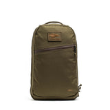 The Double Compartment Bullet Ruck - Ballistic Nylon Cordura - 18L by GORUCK EU is an olive green carry-on backpack featuring a top handle, a front zipper pocket, and a rectangular logo patch near the top. It includes a bombproof laptop compartment to keep your devices secure on the go.