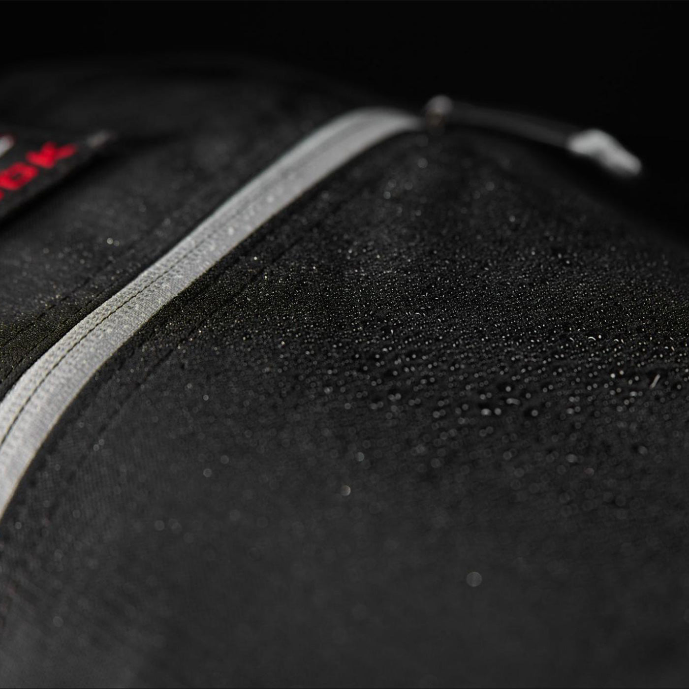A close up of a zipper.
