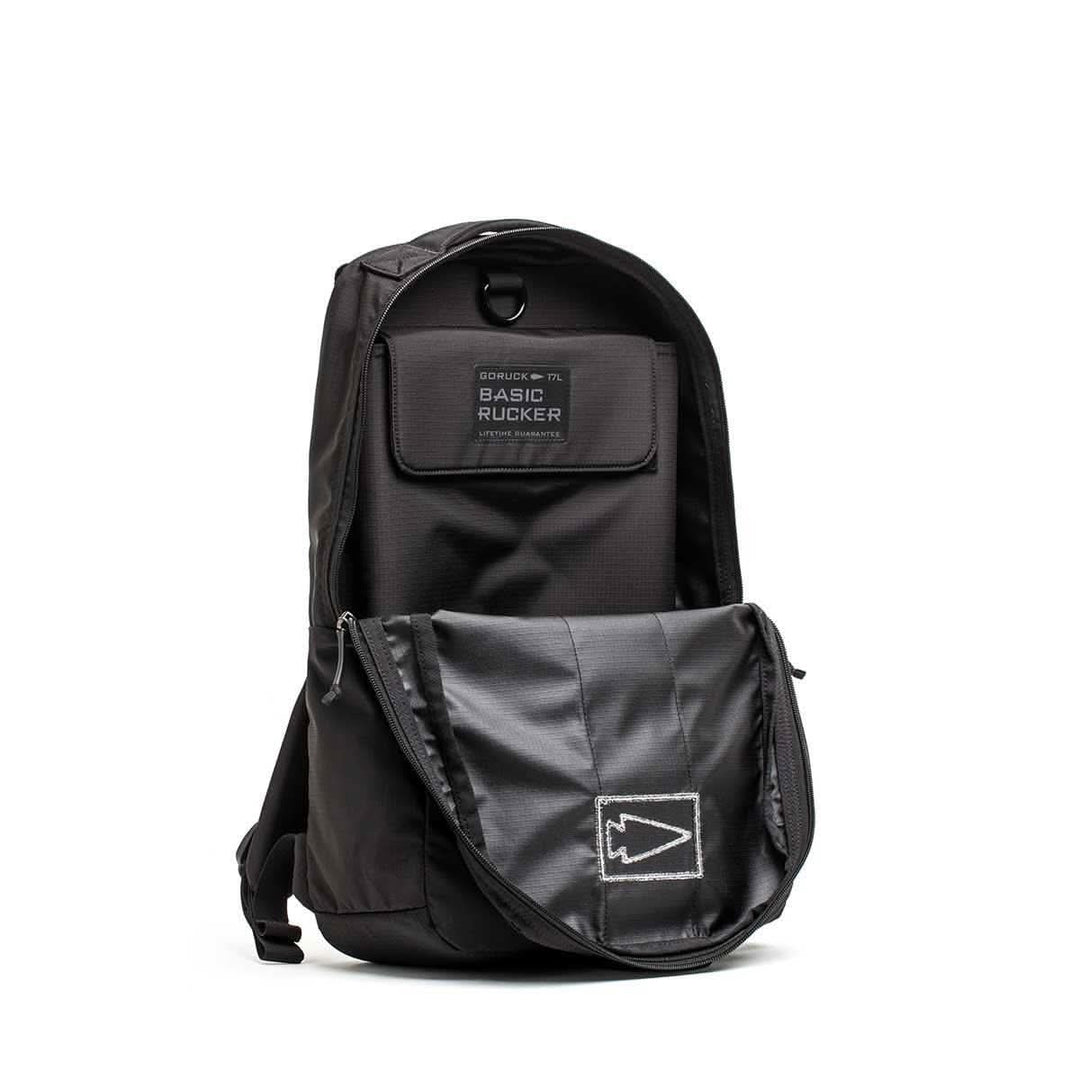 GORUCK Basic Rucker black rucksack with open front flap showing interior details.