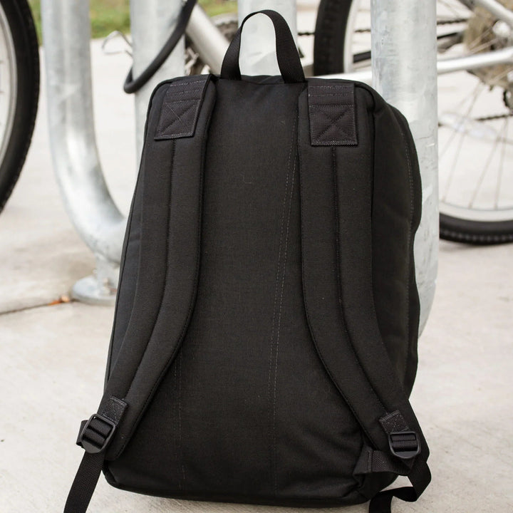 GORUCK black rucksack backpack with padded straps, outdoor by bike rack