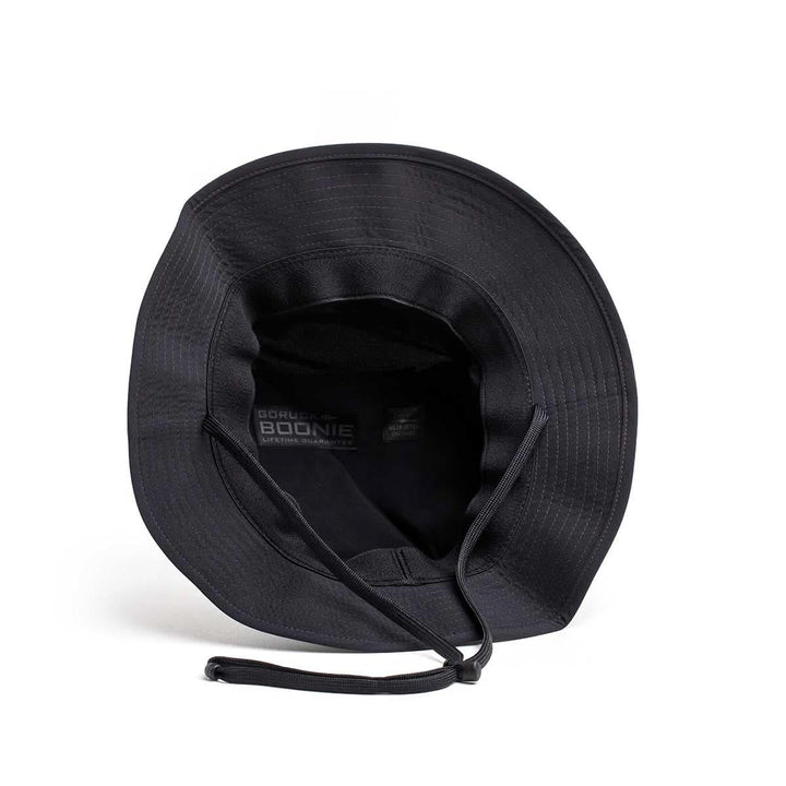 Black GORUCK Boonie Hat with chin strap, tough rucking gear, top view on white background.