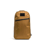 GORUCK coyote brown rucking backpack with black zipper and patch, front view on white background