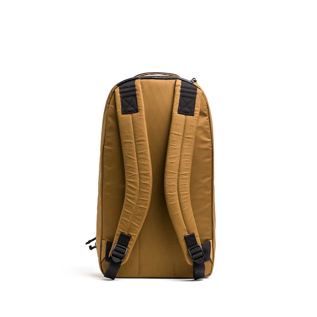 The GORUCK Bullet X-PAC daypack is shown from the back with padded shoulder straps, a top handle, and durable X-PAC material, displayed against a white background.