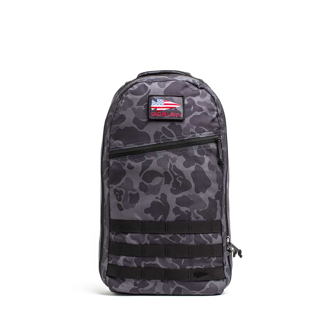 The Bullet Ruck Laptop - 16L by GORUCK is a sleek black backpack that seamlessly combines style with functionality. It includes a zippered front pocket, two side zippers, and a top handle. Designed for everyday use, this durable backpack offers subtle lumbar support and comes equipped with a laptop compartment.