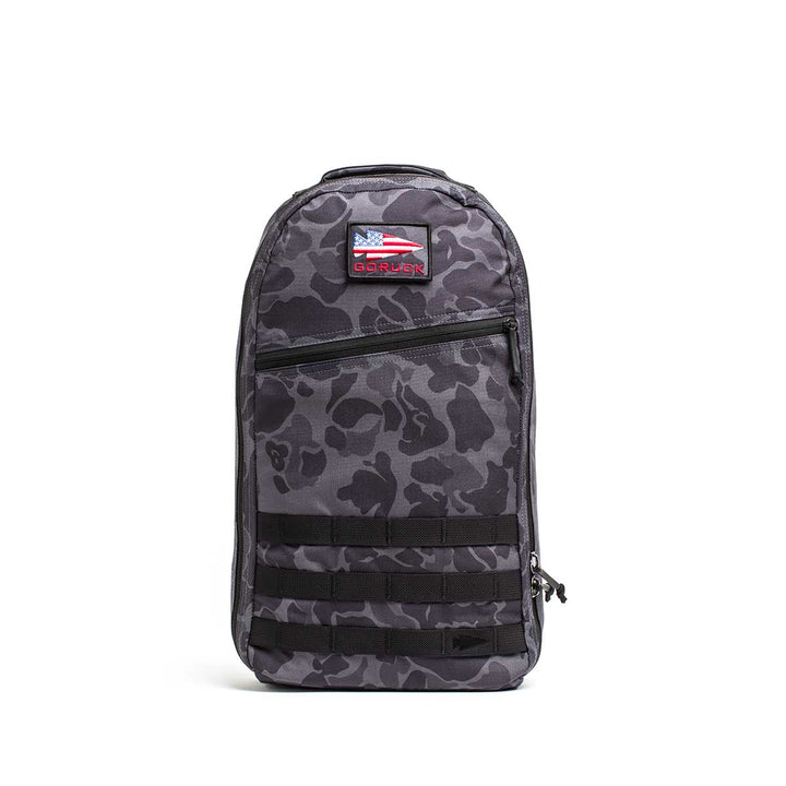 The Bullet Ruck Laptop - 16L by GORUCK is a sleek black backpack that seamlessly combines style with functionality. It includes a zippered front pocket, two side zippers, and a top handle. Designed for everyday use, this durable backpack offers subtle lumbar support and comes equipped with a laptop compartment.