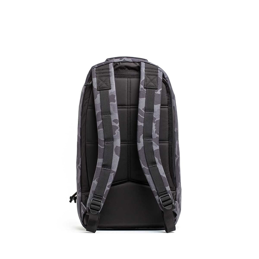 The Bullet Ruck Laptop - 16L by GORUCK is a sleek black backpack that seamlessly combines style with functionality. It includes a zippered front pocket, two side zippers, and a top handle. Designed for everyday use, this durable backpack offers subtle lumbar support and comes equipped with a laptop compartment.
