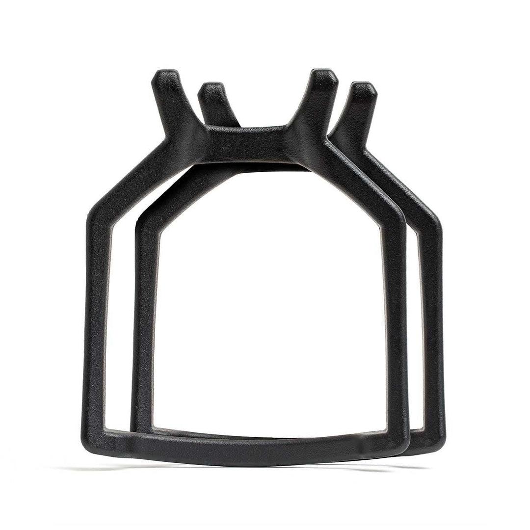 Curved Ruck Plates in black cast iron feature a geometric, crown-like design reminiscent of weight vest plates, shown against a white background.