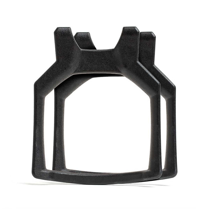 Two black Curved Ruck Plates, angular and plastic with squared bottoms and forked tops—ideal as weight plates for your rucking weight vest.