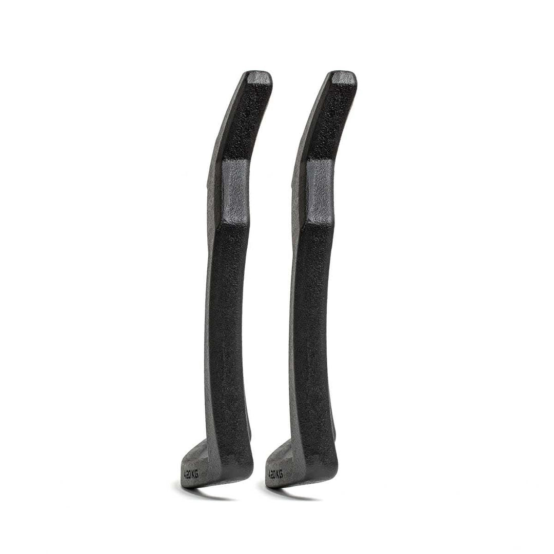 Two black Curved Ruck Plates stand upright, side by side, on a white background—durable and ideal for prepping gear for rugged rides or rucking weight vest training sessions.