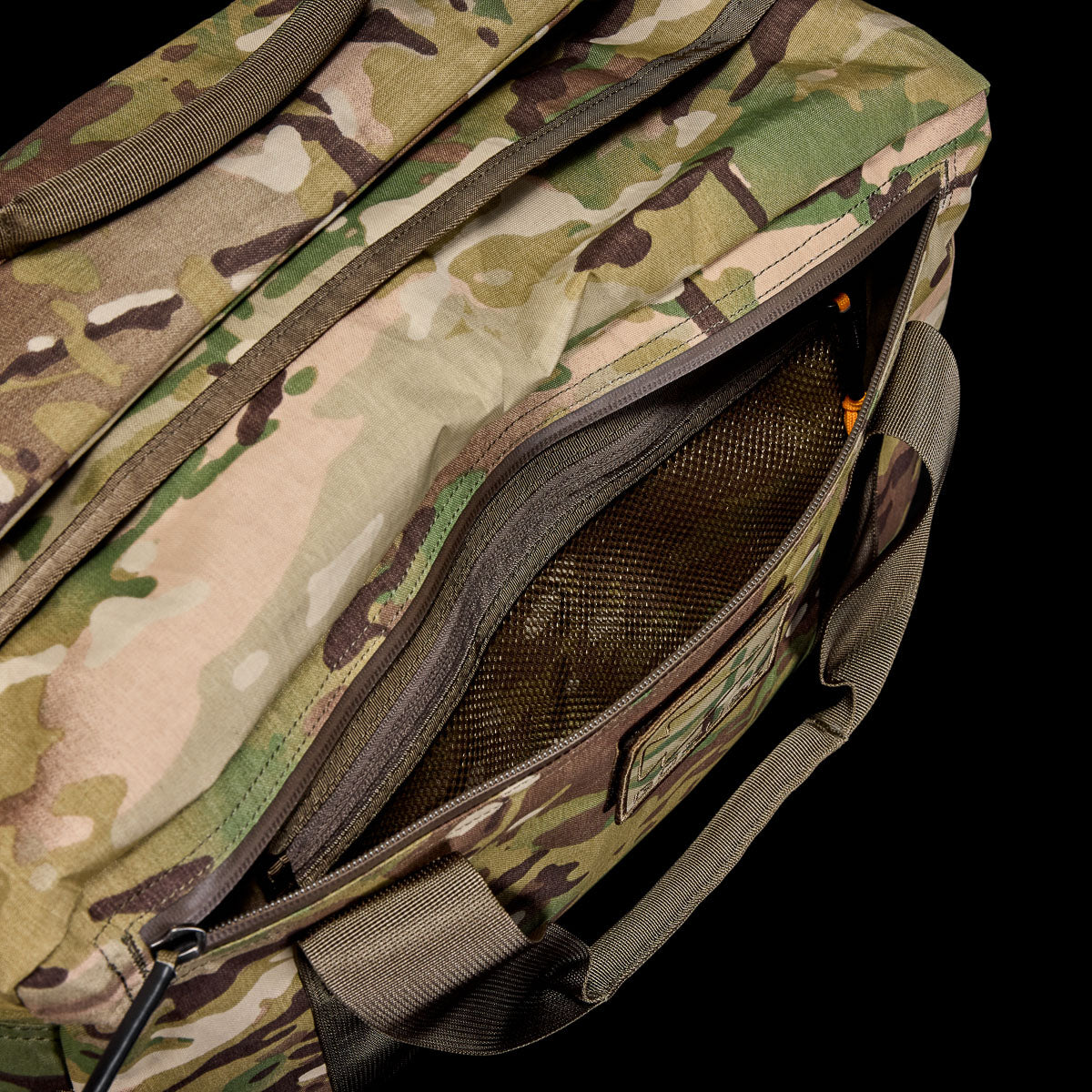 GORUCK X-Pac Multicam 32L kit bag with zippered mesh pocket, camo gear close-up