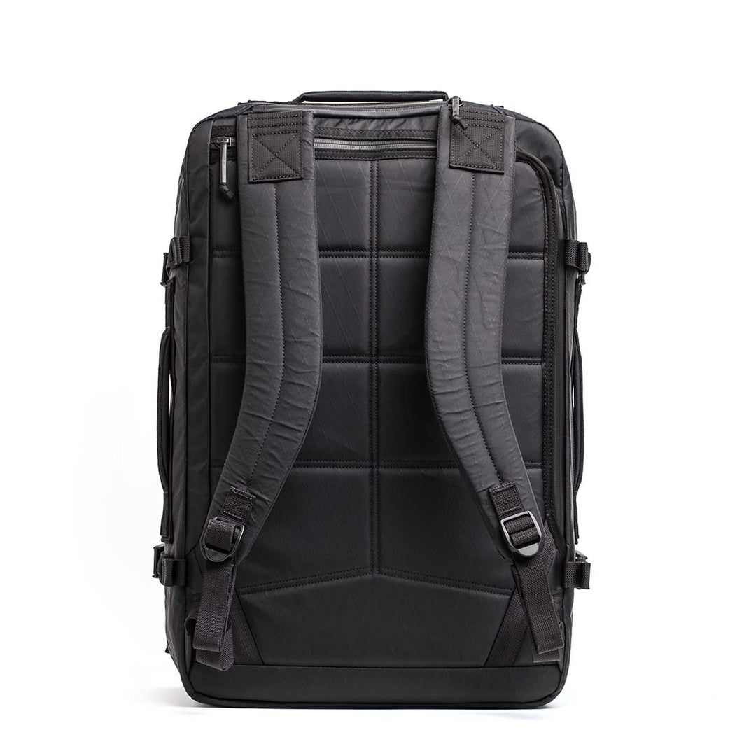 The GORUCK GR3 - X-PAC backpack stands upright, displaying its padded back panel and adjustable shoulder straps, crafted from waterproof X-PAC material.