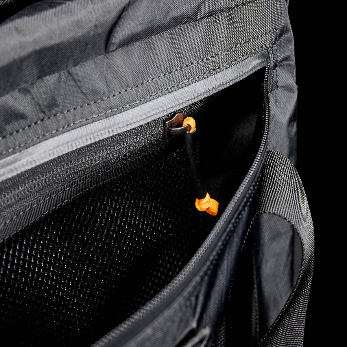 GORUCK XPAC Black 32L Kit Bag showing durable zippered pocket and mesh interior.