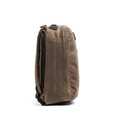 The GR1 USA - Heritage by GORUCK is a brown, minimally designed heritage rucksack. It features multiple zippered compartments and is crafted from durable waxed canvas for both style and practicality.