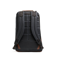 Back view of the GORUCK GR1 USA - Heritage rucksack in waxed duck canvas, featuring padded straps and brown accents on a white background.