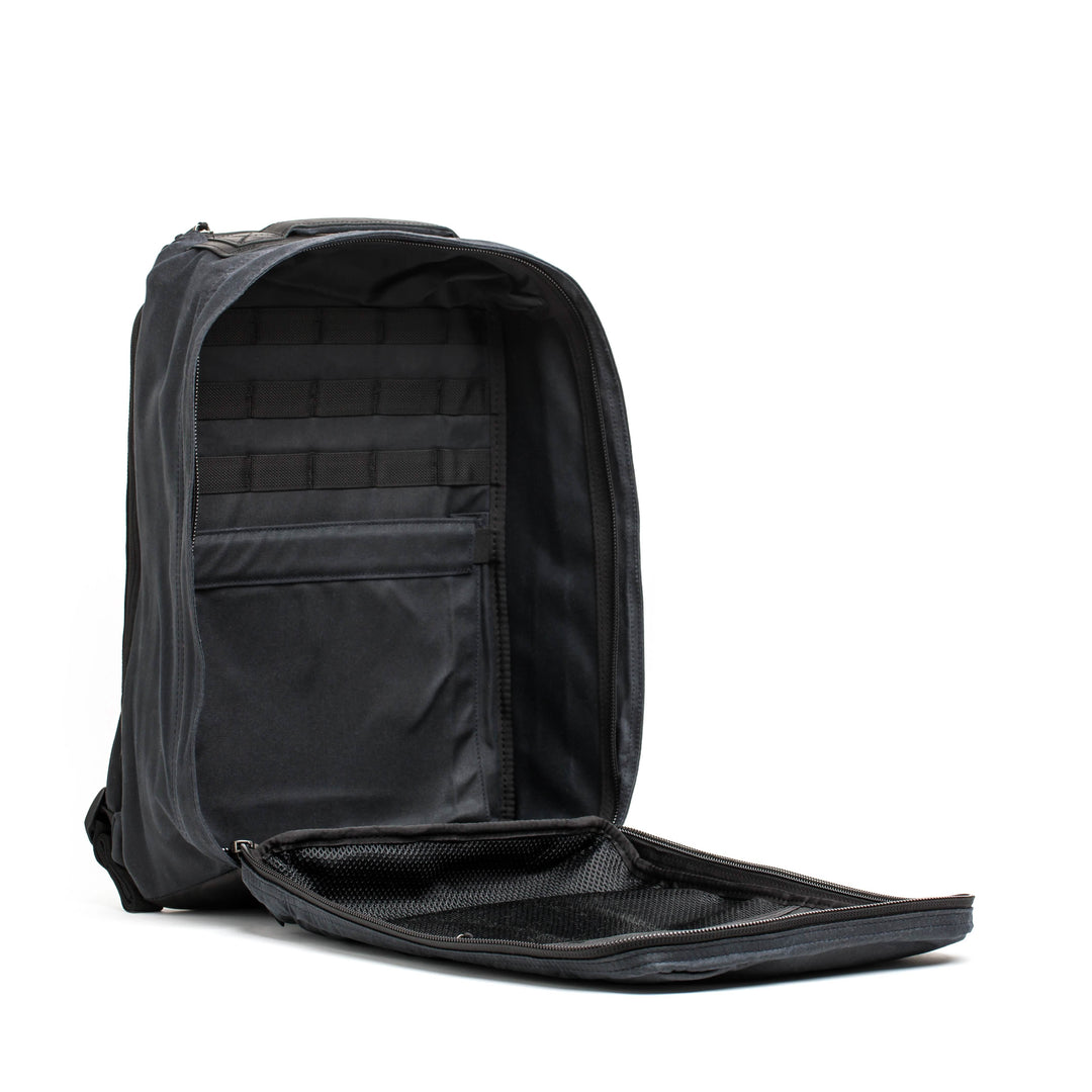 Showcase the GR1 USA - Heritage by GORUCK, a durable backpack featuring multiple compartments and a mesh pocket, on a white background, capturing the charm of a retro rucksack.