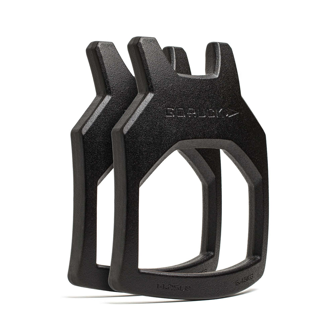 Two black Curved Ruck Plates from GORUCK EU are shown upright against a white background—ideal for swapping out weight plates in your vest during intense workouts.