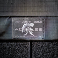 Close-up of the "GORUCK 30LB ACHILLES LIFETIME GUARANTEE" patch with a Spartan helmet on the Achilles | Men's Weighted Vest.
