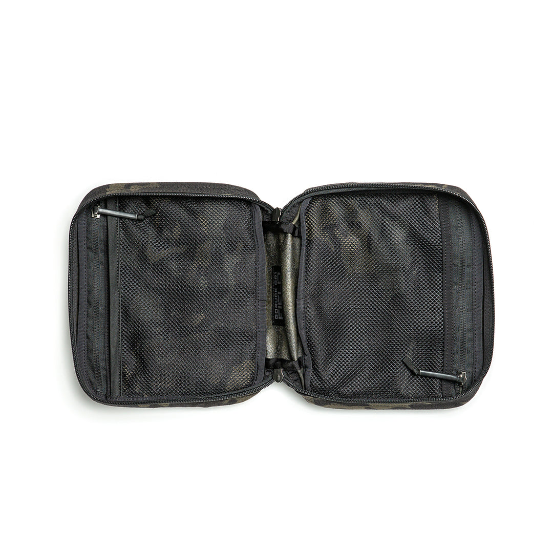 The GORUCK GR2 Field Pocket, made from tough 1000D Cordura, is shown open on a white background with mesh pockets and an empty interior.