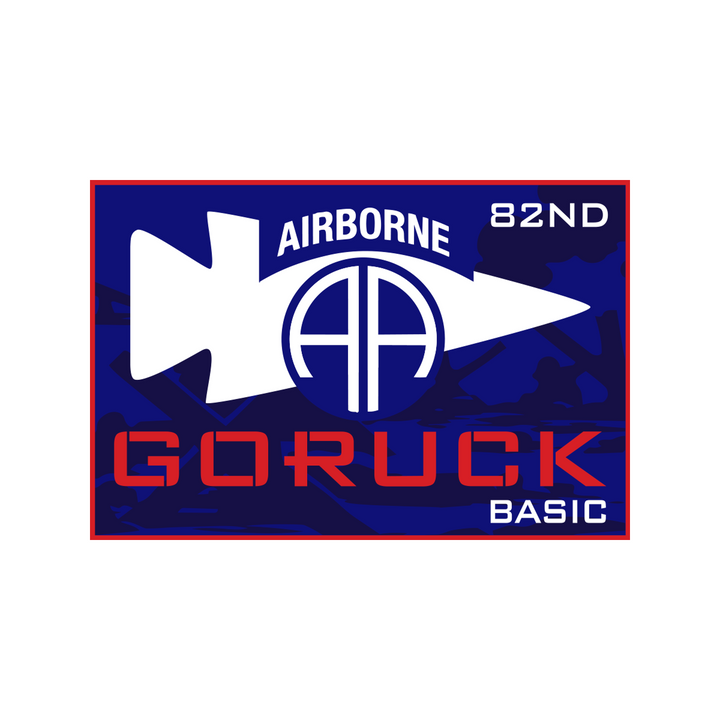 Dark blue patch from the Normandy Event Weekend features "AIRBORNE 82ND GORUCK BASIC" and a white arrow circling AA, honoring the 82nd Airborne Division's legacy from D-Day Normandy.