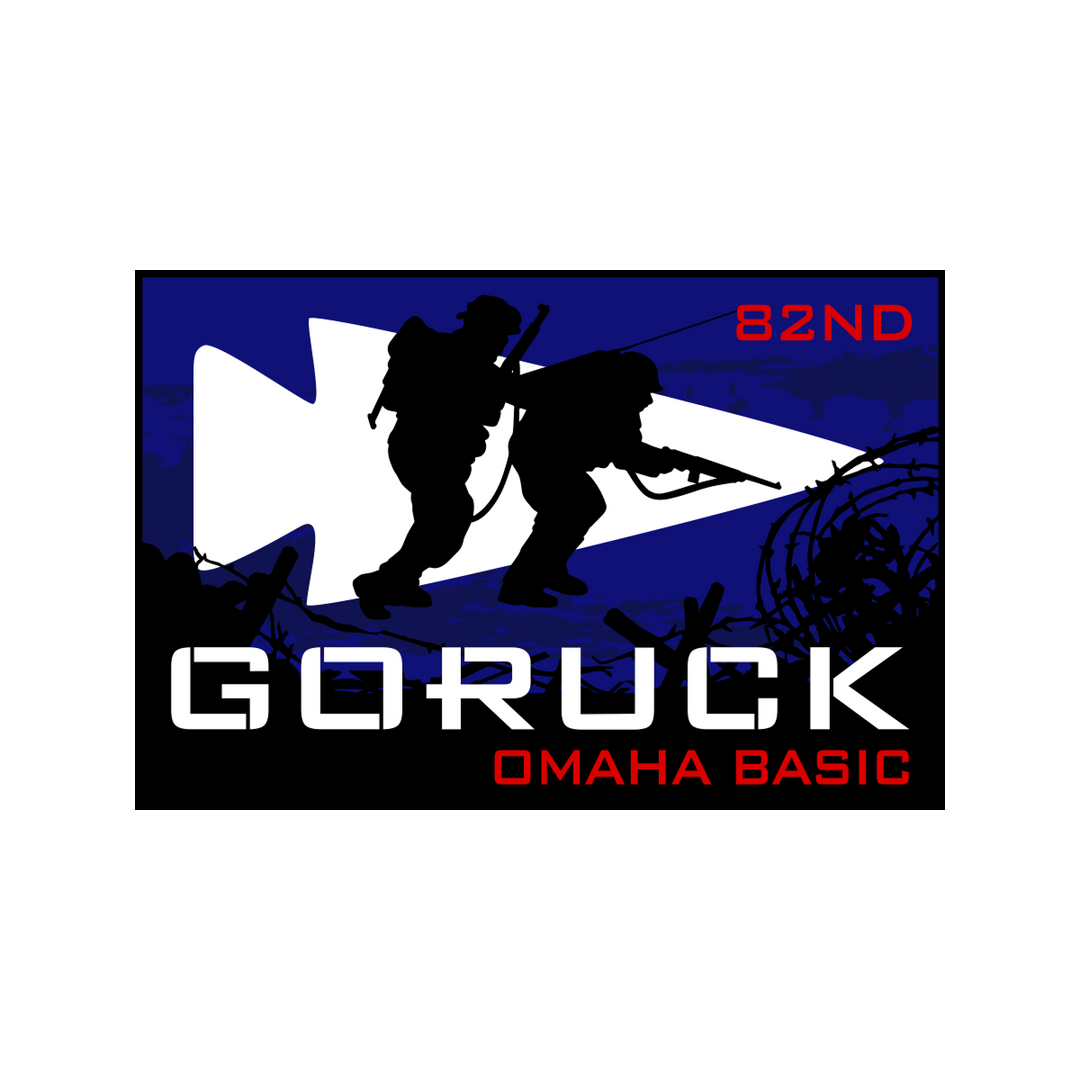 Silhouetted soldiers stand before a blue arrowhead with text: "GORUCK 82ND OMAHA BASIC"—honoring the 82nd Airborne Division’s heroism during Normandy Event Weekend.