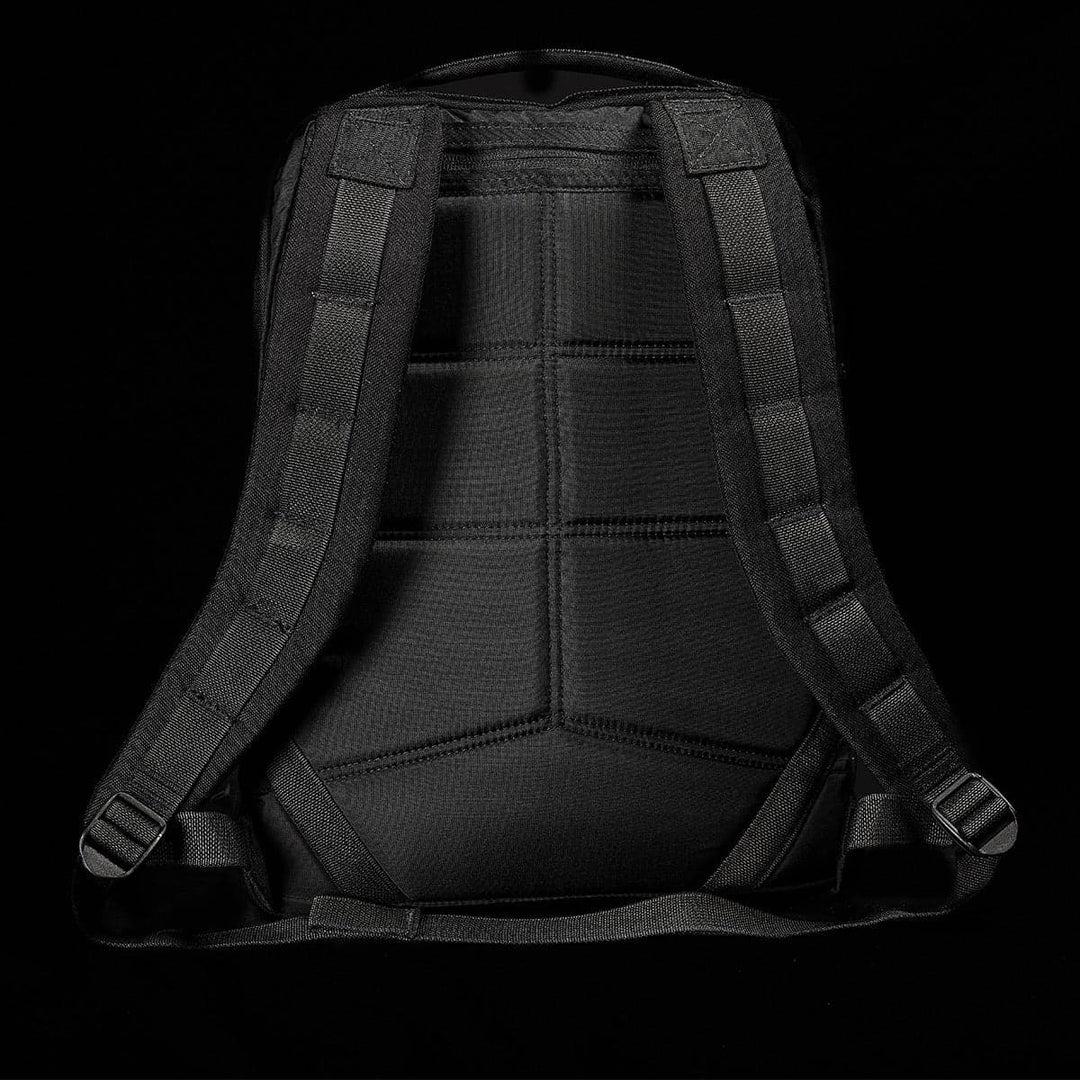 The GR0 - Cordura by GORUCK is displayed from the back against a dark background. This compact backpack showcases padded shoulder straps, a handle, and detailed stitching, emphasizing its minimalist EDC design and robust laptop compartment for enhanced durability.