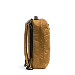 GORUCK brown XPAC rucksack side view on white background, durable rucking backpack