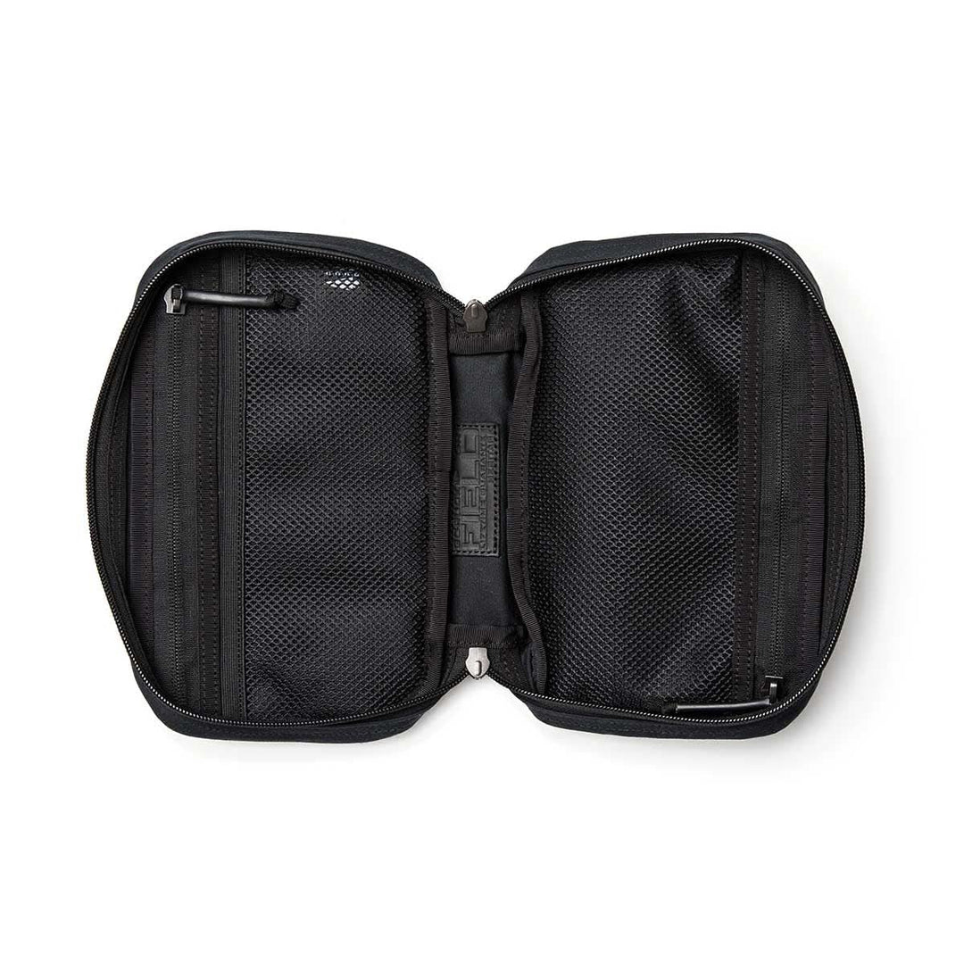 Open black travel pouch with mesh zippered compartments and central divider, viewed from above—perfect for organizing essentials in your GORUCK GR1 Field Pocket - Waxed Canvas.
