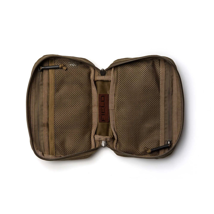 The GR1 Field Pocket - Waxed Canvas lies open on a white background, showcasing mesh pockets—ideal for pairing with your GR1 Heritage ruck or organizing Red Wing leather essentials.