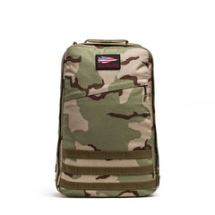 The GR1 USA - Ballistic Nylon Cordura (The Original Ruck) is a camouflage-patterned backpack featuring a rectangular GORUCK patch near the top center, built for exceptional toughness and lasting quality.