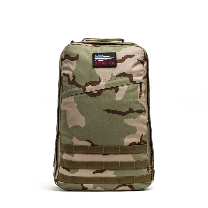 The GORUCK GR1 USA rucksack by GORUCK features a camouflage pattern, durable 210D CORDURA fabric, and a front logo patch on a white background.