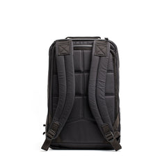 The back view of the GR1 USA - X-PAC backpack by GORUCK showcases its padded straps and AquaGuard zippers set against a white background.