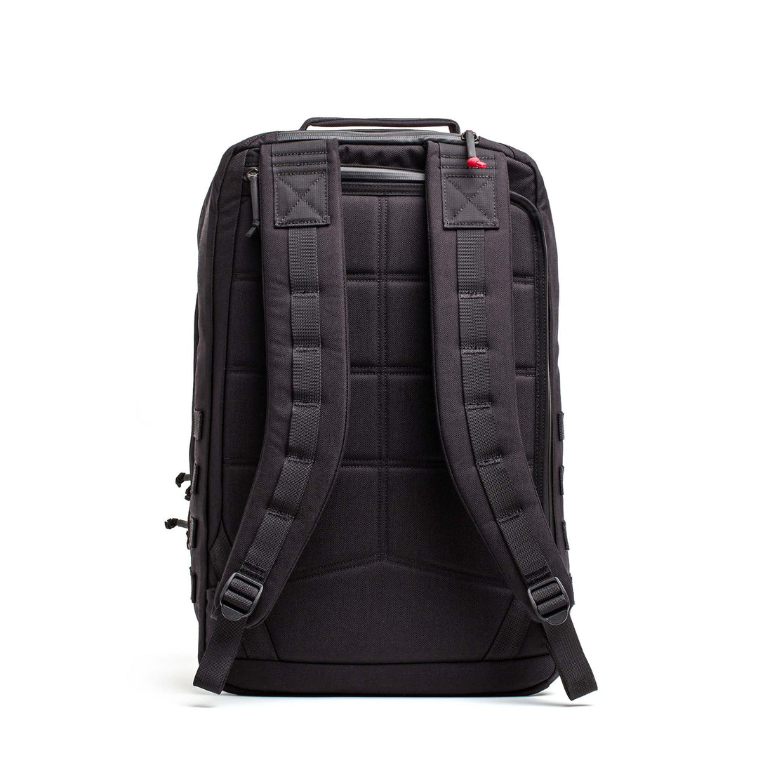 The GORUCK GR2 backpack in black, displayed from the back on a white background, features padded shoulder straps and a top handle.